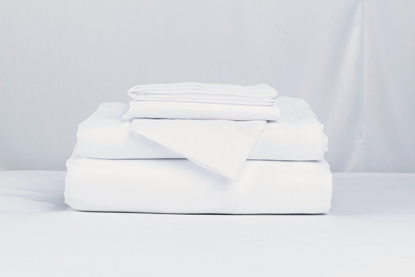 A stack of crisp folded white linens
